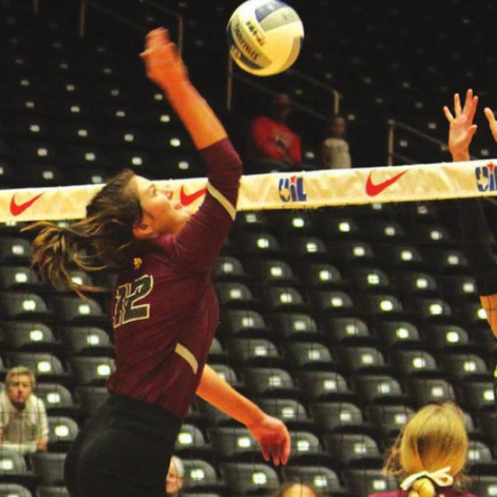 Above: Kayme Schley spikes a ball in in the title match.