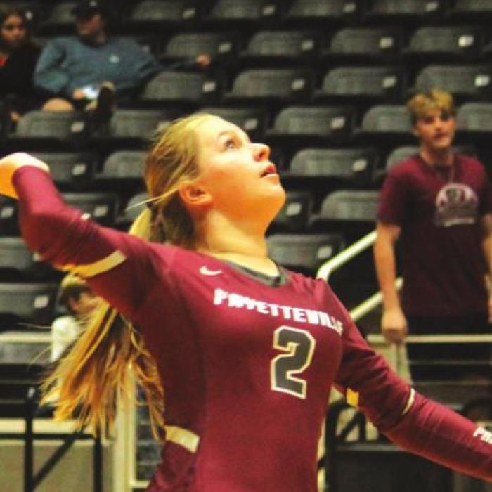 Right: Rylie Dyer serving. Photos by Jeff Wick