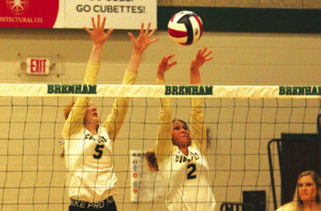 Kaysie Ward and Tess Eilers on a block.