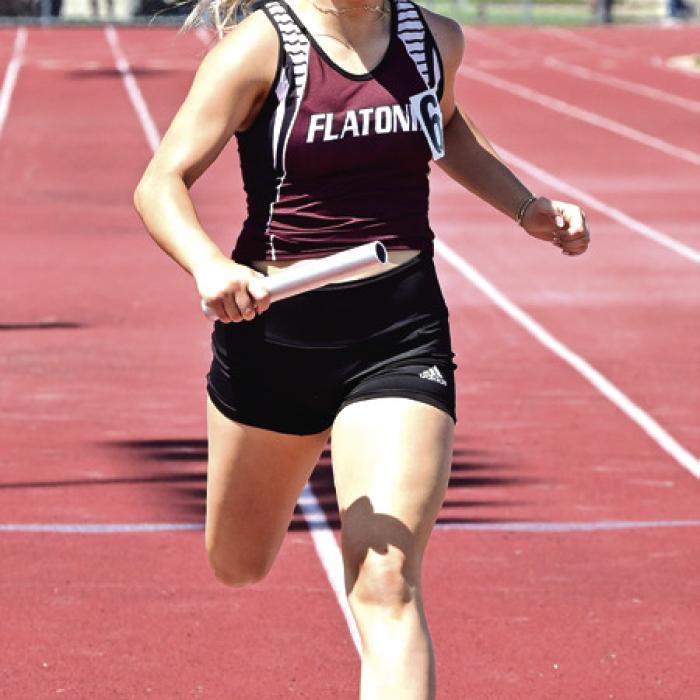Flatonia’s Brynlee Zimmerman runs the last leg of the 4x200 Relay, which is regional bound for the Lady Bulldogs.