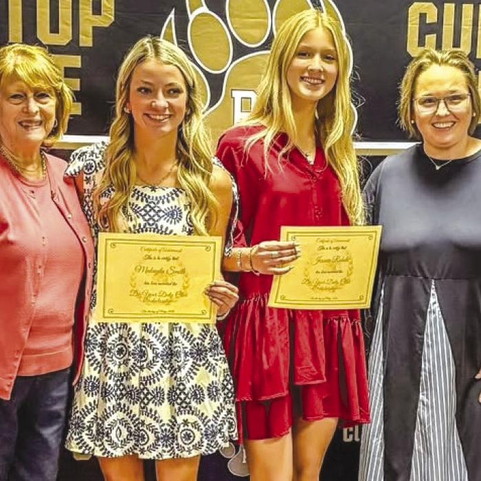 Round Top DYD members Donna Barr and Holly Johnson presented scholarships to Makayla Smith and Jessica Rohde at the May 6 RT-C Academic Banquet.