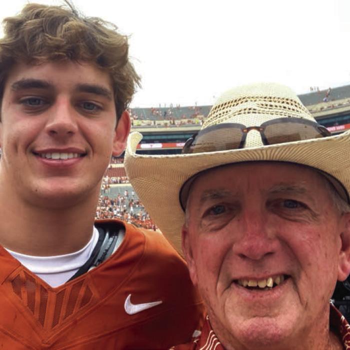 Arch Manning and Jimmy Dwigans on the field after the game.