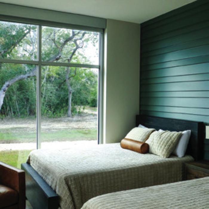 Each room in Lutherhill’s new retreat center features double queen beds and floor-to-ceiling windows.