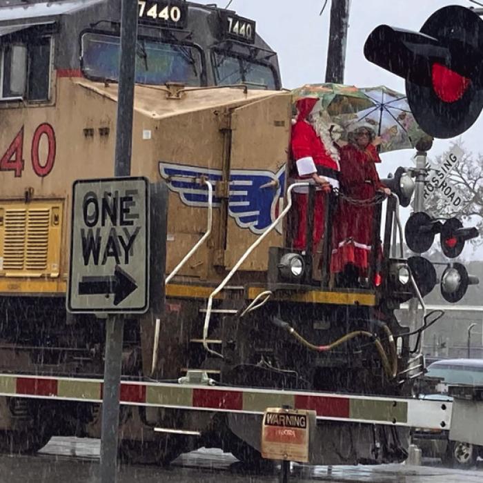 Santa and Mrs. Claus made an early stop in La Grange Saturday on the front of a train (in a rainstorm!) and then disembarked to visit with kids at the MKT Depot Museum.