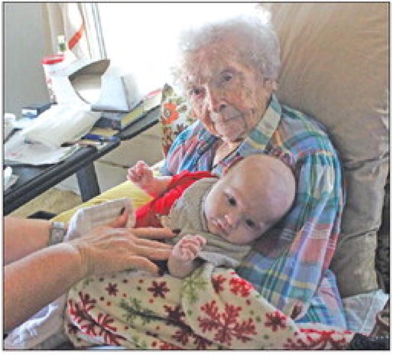 Mary Lee Mewis, 107, holds her two-month-old great great grandson Hudson during a visit at her home Friday. Photo by Jeff Wick