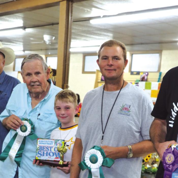 Ag Department: Patrick Hoffmann And Richard Hoffmann-Corn;James Tiemann-Peppers, with Tiemann’s grandson holding plaque; Dustin Machinsky-Watermelon Jubilee; And Brett Janecka-Honey.