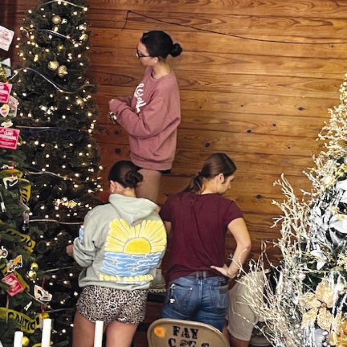 Setting up for the annual Fayetteville Chrismtas Christmas Tree Display in the old fire station.