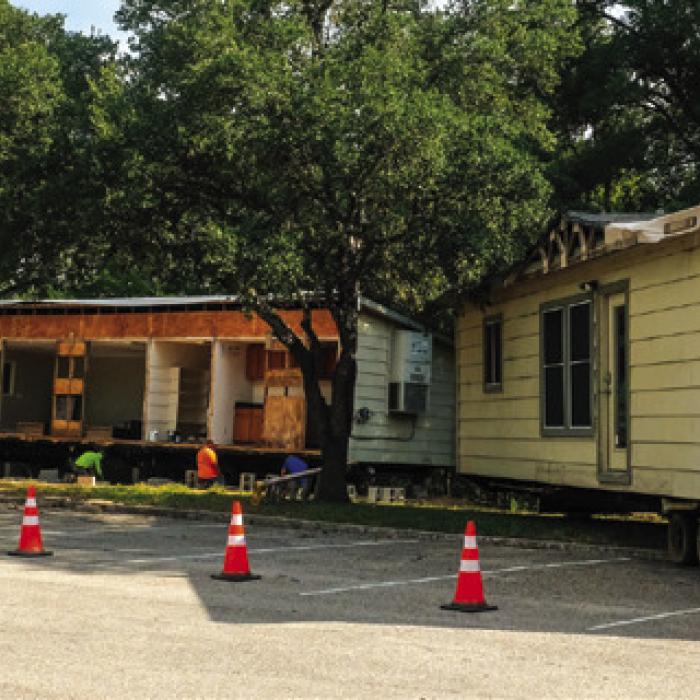 Workers at Kreische Brewery and Monument Hill State Historic Sites set up a modular building (right) to serve as a temporary visitors center. The State Legislature approved $4.3 million in funding to replace the 1960s-era A-frame visitors center (above). The project will include new restrooms. Photos by Andy Behlen