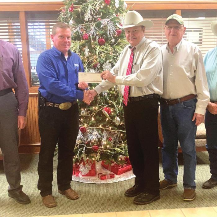 Pictured from left representing Round Top State Bank is: President/Ceo Dave Weishuhn, EVP/CFO/ COO Calvin Krause and represnting the Fayette County Crime Stoppers is President Dan Mueller, 2nd Vice President Joe Cernosek, and Secretary Randy Noviskie.