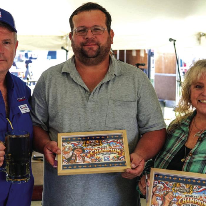 Winners of the stein holding competition at the Texas Czech Heritage and Cultural Center’s Heritage Fest in La Grange on Saturday, sponsored by the SPJST, were Adam Cernosek of La Grange (center) in the men’s division and Theresa Greenwell of Lake Jackson in the women’s division. They are pictured with SPJST President Brian Vanicek. Photos by Andy Behlen