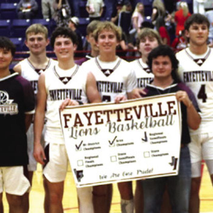 The Fayetteville Lions won a thrilling overtime contest Tuesday 80-74 over Wells in Madisonville to advance to the 1A basketball state quarterfinals for the third consecutive season. Lots more on the game on Page B1. Photo by Ken Sury