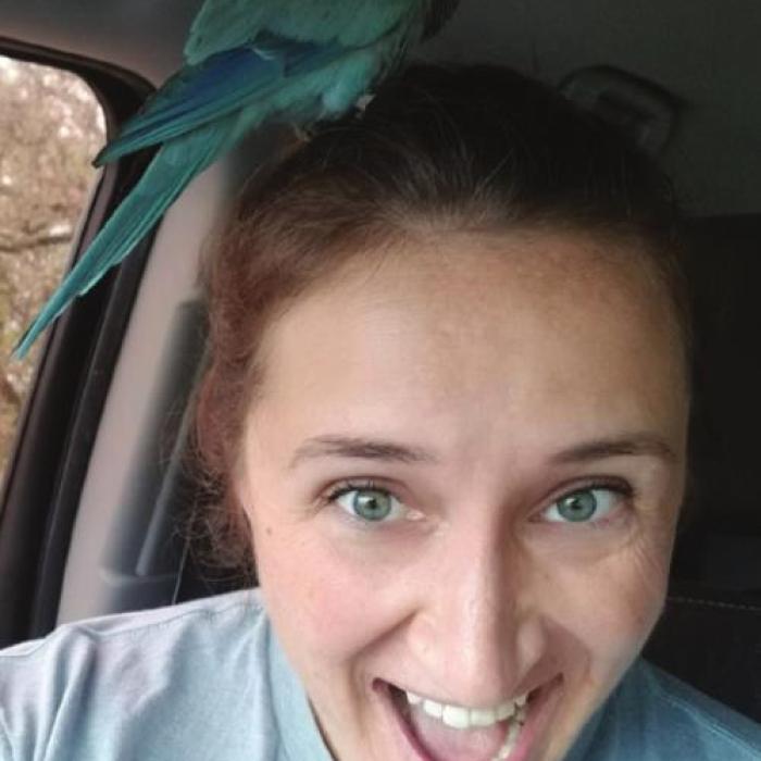Loretta Greenwood with her pet Quaker parakeet, Prof. Oats, after she found him on Monday. The bird took a bit of an adventure over the weekend after escaping from his cage on Friday.