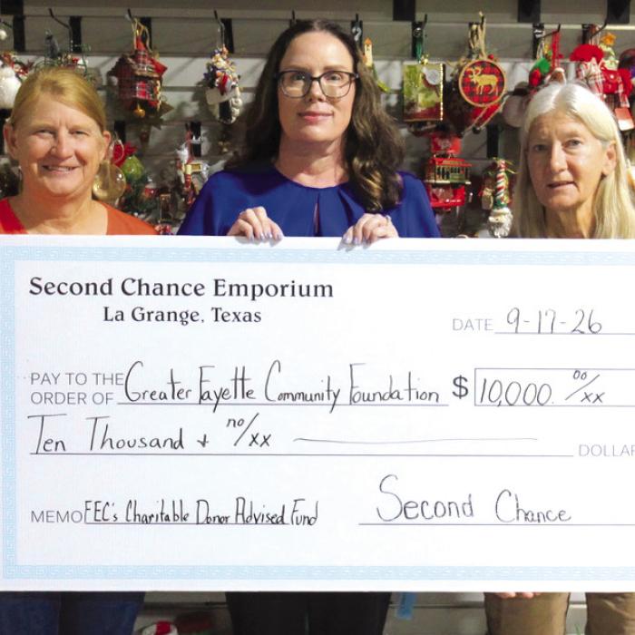 Tracy Denton, director of marketing, communications, and training at Fayette Electric Cooperative (center), gratefully receives a grant from Marlene Schnell, assistant store director at Second Chance Emporium (left), and Gayle Schielack, store director at Second Chance Emporium (right). These funds will help Fayette Electric Cooperative’s Charitable Donor-Advised Fund continue providing free books to children in Fayette County through Dolly Parton’s Imagination Library.