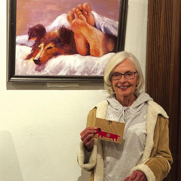 Karen Bookout earned first place in the Pet Portrait contest at the Live Oak Art Center in Columbus with her painting, “Friendly Bedfellows.”