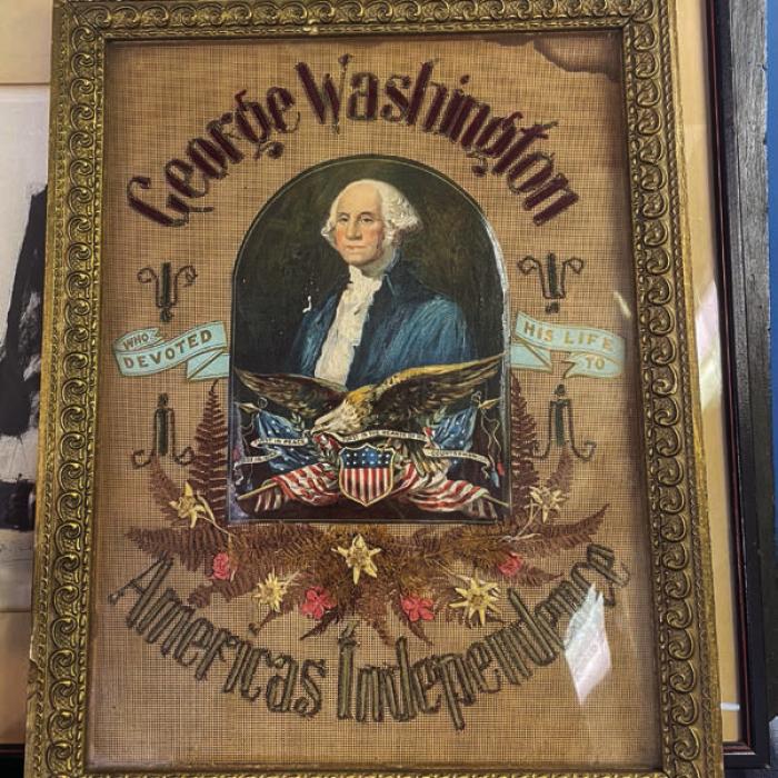A piece of intricate needlework featuring George Washington.