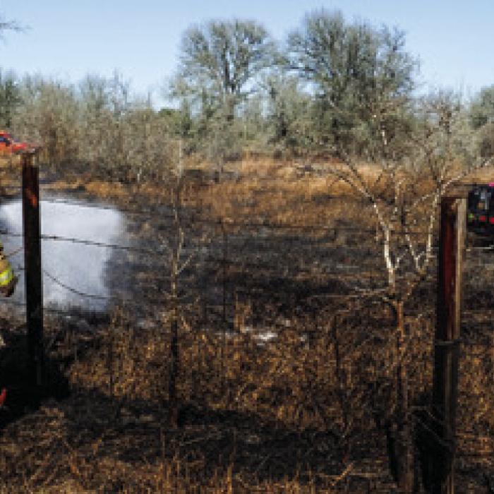 Last Friday, Ellinger and La Grange firefighters stayed busy fighting a series of grass fires that afternoon, including the one pictured (left) near the intersection of Kitchen Ln. and SH 71. Photo by Andy Behlen