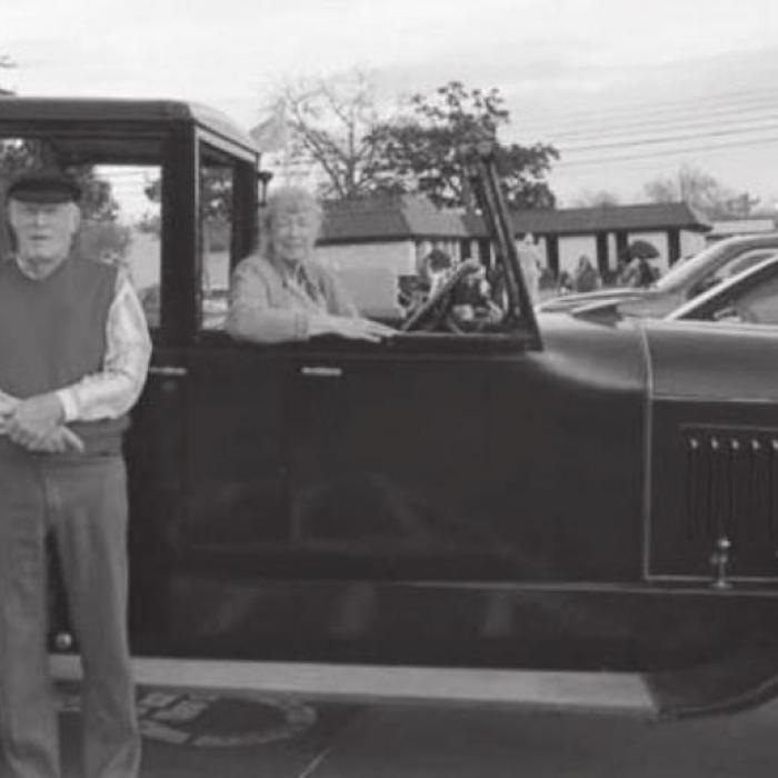 Arnold also is an old car enthusiast. Here, he and Suzy give Santa a ride in one of his three Pierce-Arrow Motor Cars that date back to the early years of the 20th century.