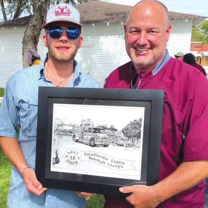 Corbin Hahn and FISD Superintendent Dr. Jeff Harvey with Pat Johnson’s framed drawing.