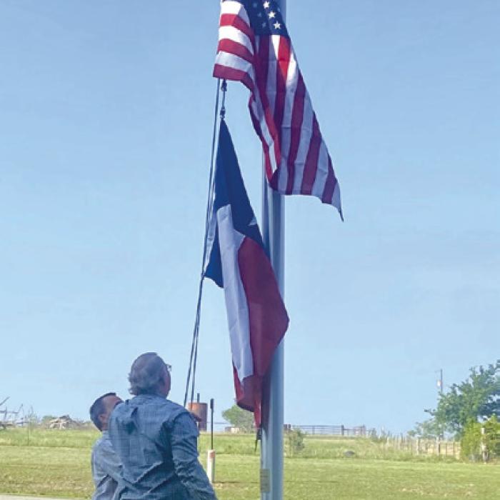 On Sunday, June 9, KJZT St. Elizabeth Society No. 20 donated new flags to St. Cyril &amp; Methodius Catholic Church in Cistern. Breakfast of sausage wraps, hot dogs, sweet rolls, and fruit was served after a brief flag raising ceremony. Patrick Vinklarek and Charles Vinklarek are shown raising the flags.