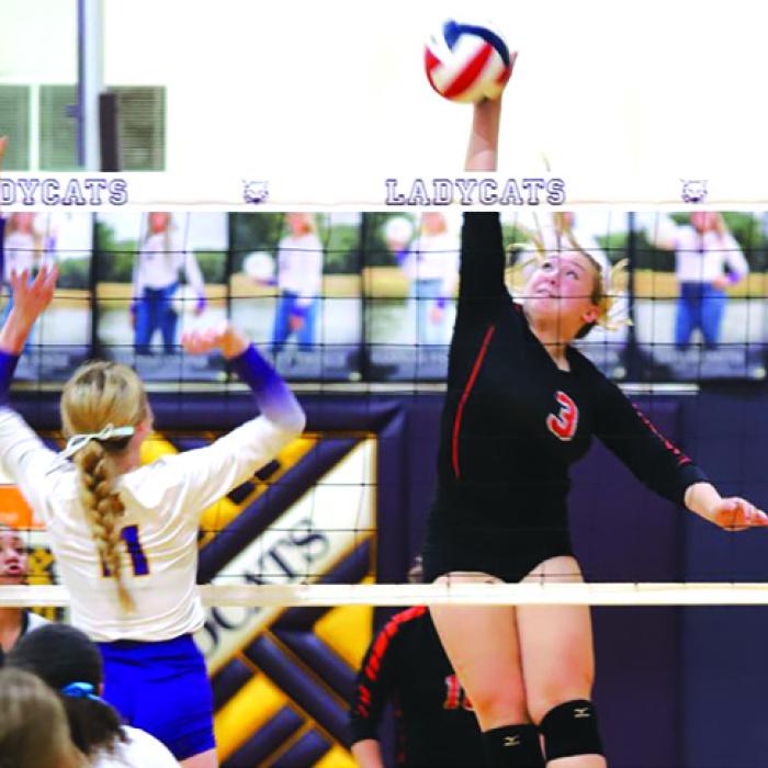 Schulenburg’s Reagan Dusek spikes a ball in Tuesday’s victory over Weimar. Photo by Audrey Kristynik