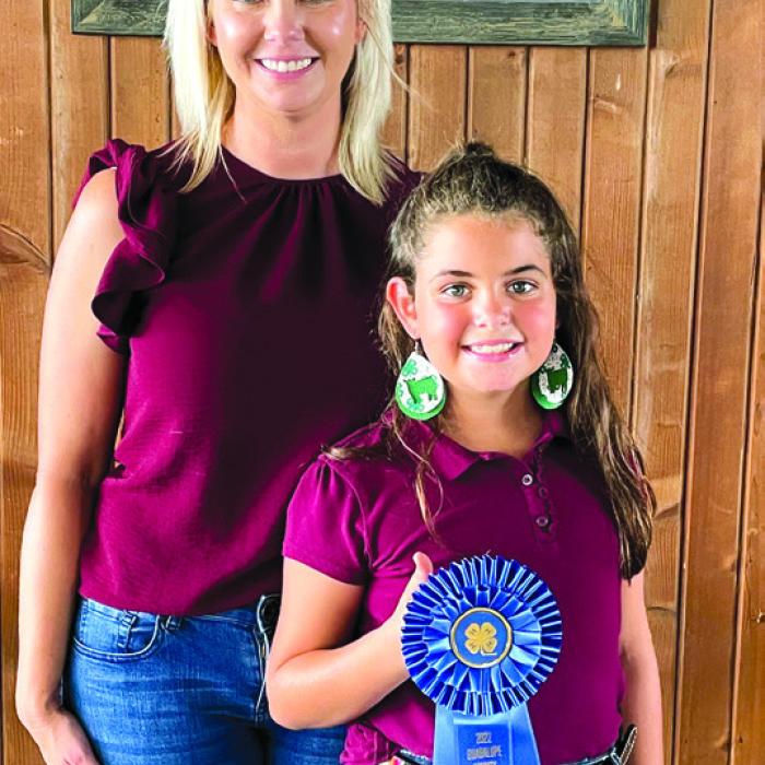 Overall High Point Swine – Adalyn Carrales, with Coach Kaci Carrales.