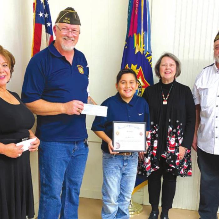 La Grange VFW and Auxiliary Patriot’s Pen winner from left: VFW and Auxiliary Contest Chairmen Mary and Richard Gray, second place winner Max Hernandez, VFW Auxiliary Secretary Marilyn Kothmann, and VFW Commander Andy Kruppa.
