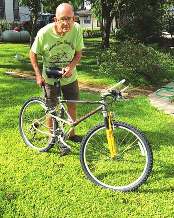 Fayetteville’s Bob McCowen shown here working on a bike.