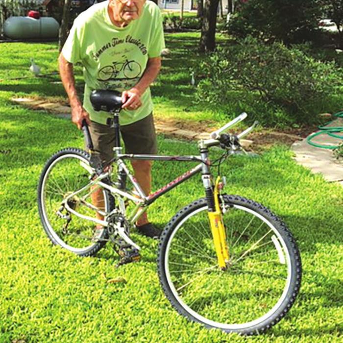 Fayetteville’s Bob McCowen shown here working on a bike.