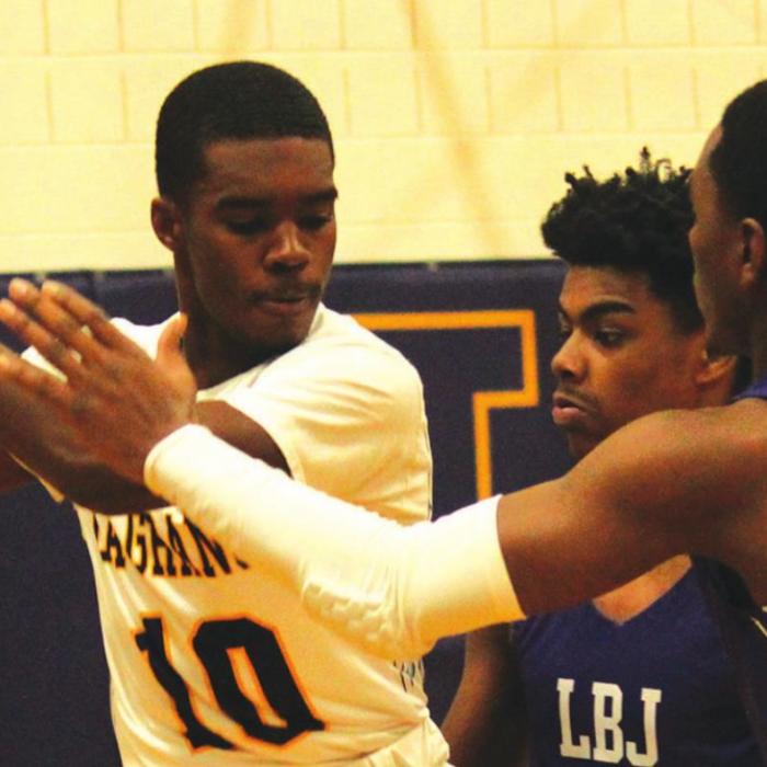 La Grange’s Jordan Scott looks for an opening amidst a double-team of Austin LBJ defenders in Tuesday’s game. Photos by Jeff Wick