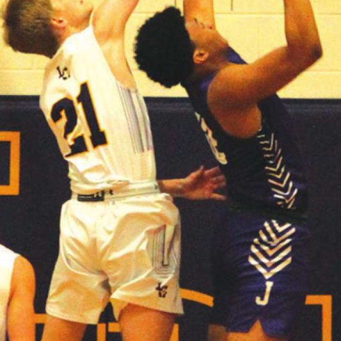 La Grange’s Ty Trlicek blocks this shot by an LBJ player in Tuesday’s game. Photo by Jeff Wick