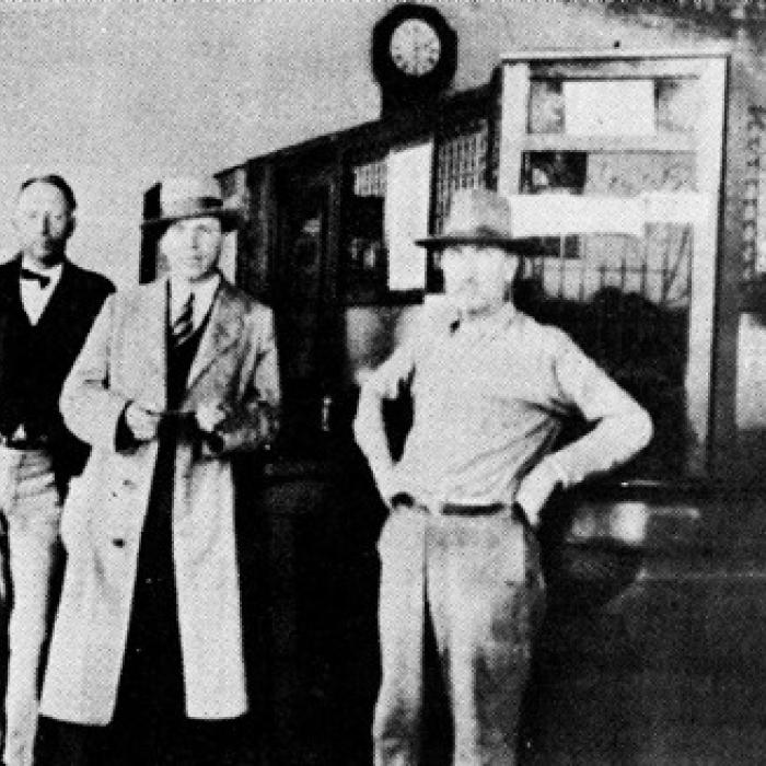 Interior of Carmine State Bank. From left, the men are William Pluekhahn, H. L. F. Doerr, Sr., Alfred Blum and W. H. Stuermer. Photo from the March 4, 1986 issue of the Fayette County Record.