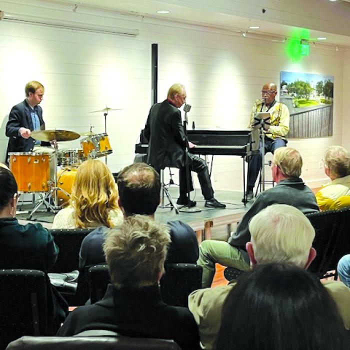 Ezra Charles (on piano) and his band rocked the house.