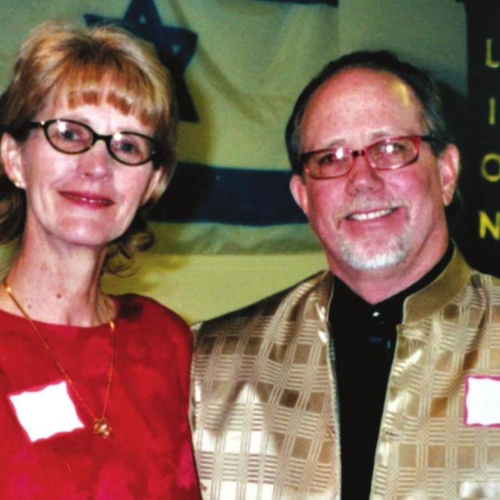 Jan and Dennis Hill, above, at the five-year anniversary of the founding of the Remnant Church at the Riverside Shopping center location, and below at a community event.