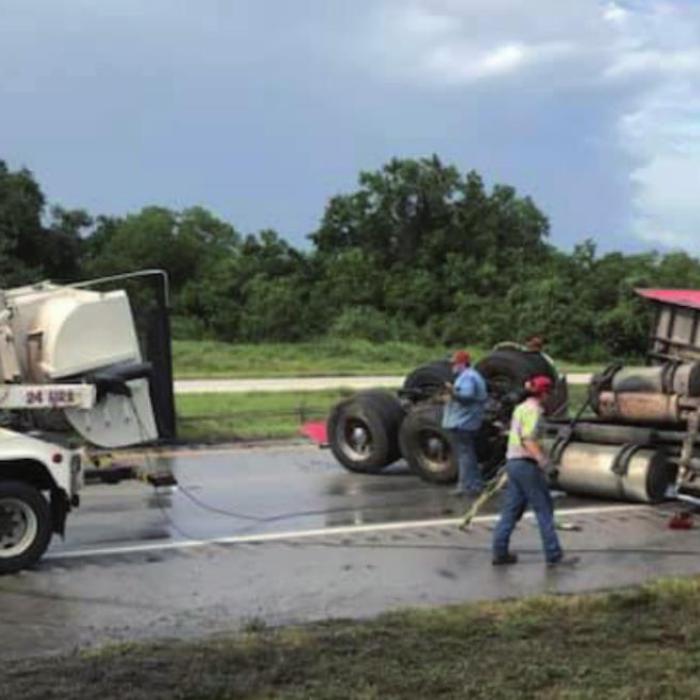 An 18-wheeler hydroplaned and rolled over on Interstate 10 east of Schulenburg Tuesday afternoon, blocking eastbound traffic for nearly two hours.