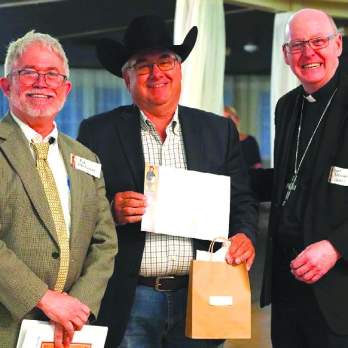 Pictured from left: Superintendent Robert Whitworth, Joe Orsak, Bishop Brendan Cahill.