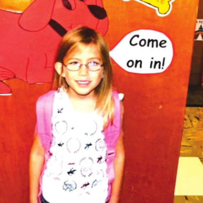 Ella Wick stands at the doorway of Mrs. Jeannette Booth’s classroom before going into her first day of kindergarten on August 24, 2009.