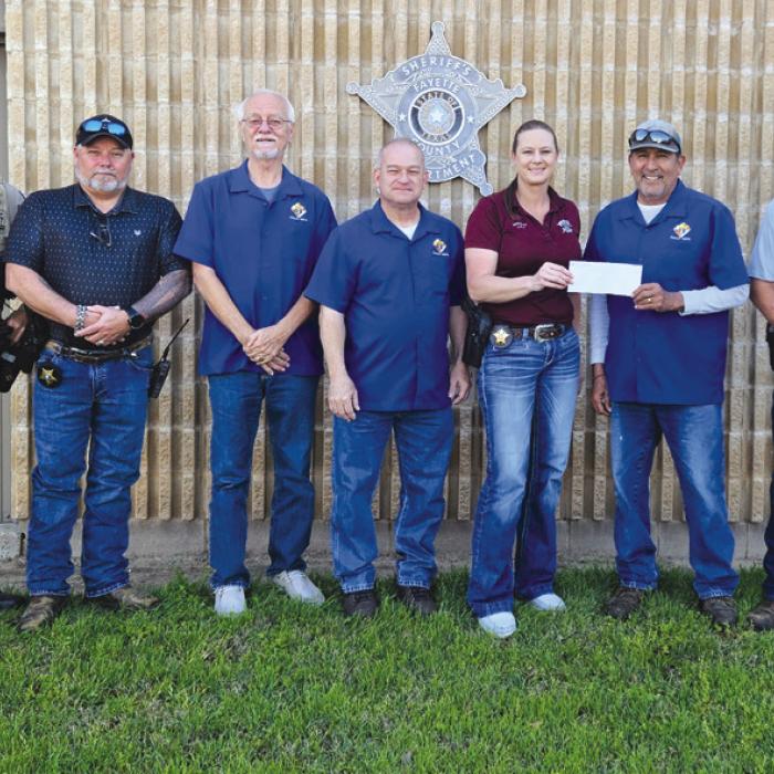 Knights of Columbus Chromcik Council No. 2574 donated $1,500 to the Fayette County Sheriff Benevolent Fund. Grand Knight Hector Cervantes presented the donation to Sgt. Angela Lala.