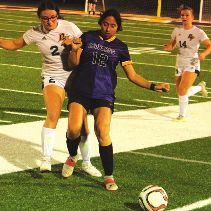 La Grange’s Camila Martinez, shown above blocking a Rockport-Fulton player, scored both goals for the Lady Leps Tuesday as they beat the Lady Pirates 2-1. Photos by Jeff Wick