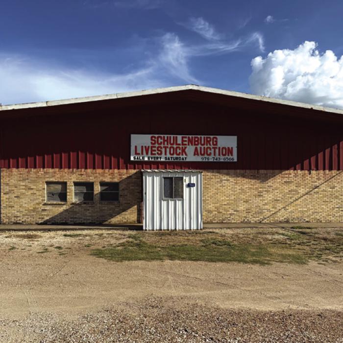 The Schulenburg Auction Barn, above, and below, some work being done there recently by the new owners.