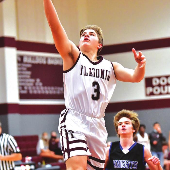 Aiden Kloesel puts it in for two for the Bulldogs on Tuesday night in Flatonia in the win over the Bellville Faith Academy Knights. Photo by Stephanie Steinhauser
