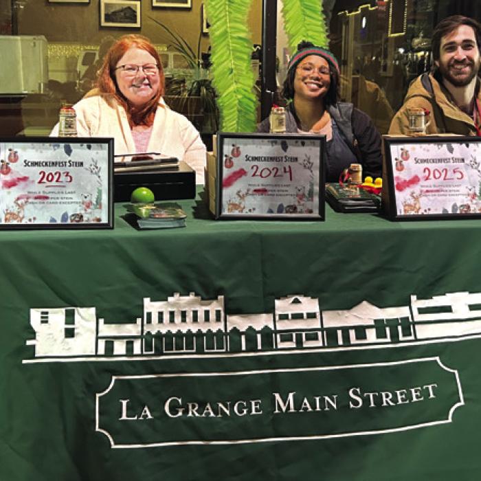 Left to right, Ashley Watkins (the City’s Tourism and Communications Coordinator) Diana Huery, (Main Street and Tourism Assistant) and Caleb Parks (La Grange Main Street Manager), during one of Main Street’s signature events here, Schmeckenfest.