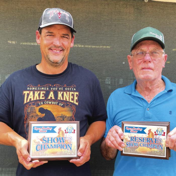 POULTRY SHOW • OPEN POULTRY from left, Linus Clark, grand; and Don Houghton, reserve