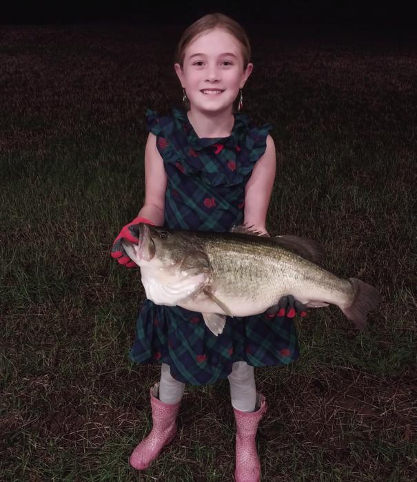 Little Girl Reels a Big Bass in Round Top