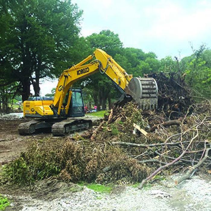Joe Rogers Dozer Service of La Grange sent a crew of heavy equipment and operators to Camp La Junta in Kerr County last week to help cleanup the campground following the devastating July 4 flood. Photos courtesy of Joe Rogers
