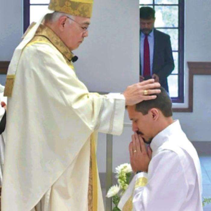 Deacon Kyle being ordained by Bishop Joe Vasquez of the Diocese of Austin Saturday at San Jose Parish.