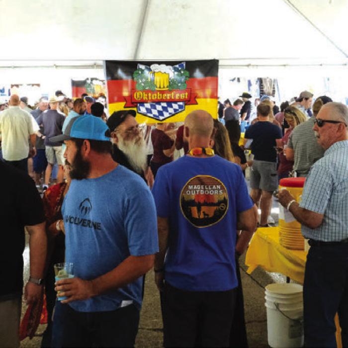 The La Grange Oktoberfest sponsored by the La Grange Rotary Club brought a big crowd to the Courthouse Square on Saturday, Oct. 1. Tickets to the event sold out on Friday. Attendees enjoyed samples of more than 80 varieties of beer from Texas, the U.S., and around the world. The Rotary Club served up delicious plates of pork schnitzel. Visitors also enjoyed music by The Dujka Brothers (below) and Michael Mach and Prime Time. Photos by Andy Behlen