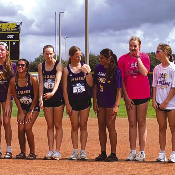 Here are shots from Sealy of the La Grange boys cross country runners at district last week, left, and the La Grange girls varsity team at the medal stand, with Lillian Carey, upper left, third individually.