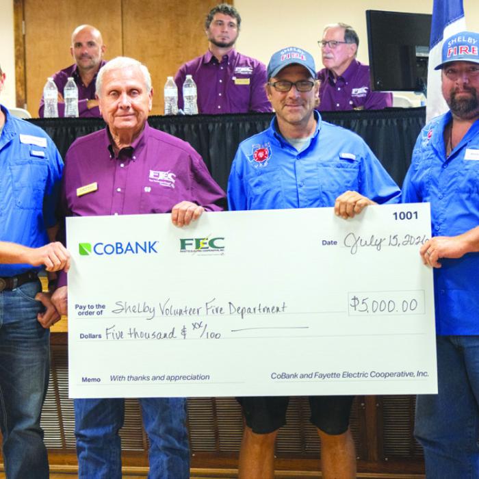 Shelby Volunteer Fire Department received $5,000 to assist with the purchase of a new pumper truck. Pictured from left to right are Shelby VFD Assistant Chief Blake Moehlmann; FEC Board President Joseph Kruppa; Shelby VFD firefighter Charles Atkins; and Shelby VFD firefighter Dennis Gaskins.