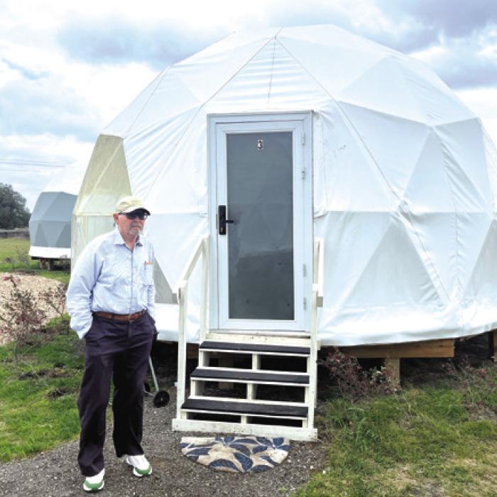 H.H. Howze checking out the igloo-like dome rentals at Flatonia’s Glamping RV Retreat. Photo by Jeff Wick