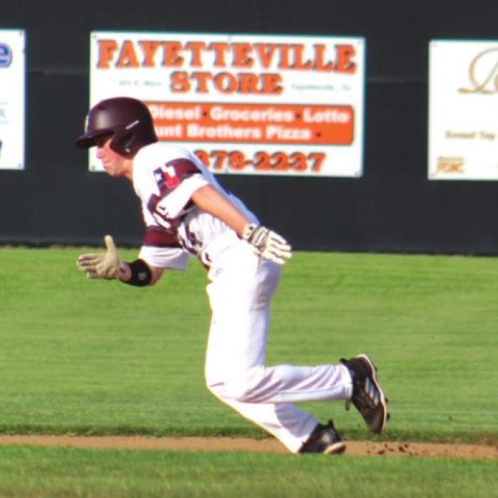 Fayetteville’s Reid Gross stealing a base Friday.